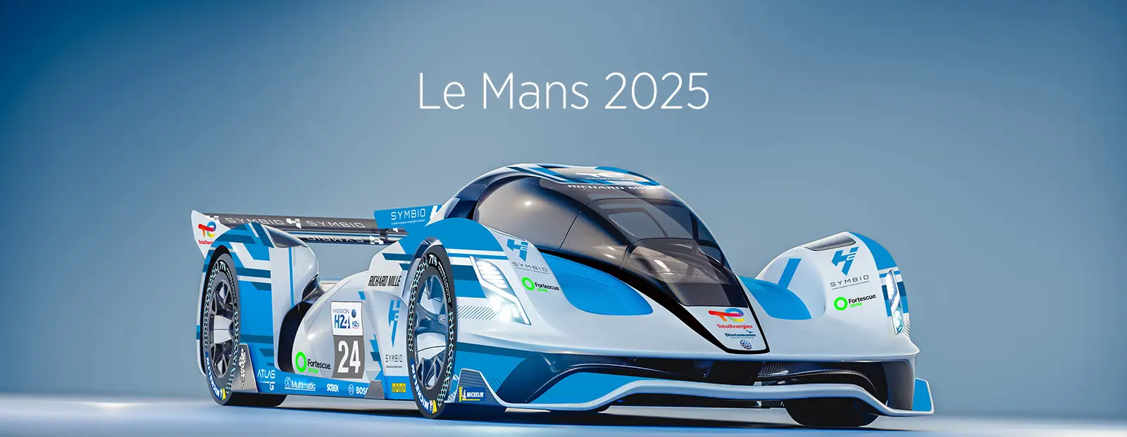 Futuristic endurance race car with blue and white livery and number 24, shown in a studio setting with the text ‘Le Mans 2025’ displayed above.